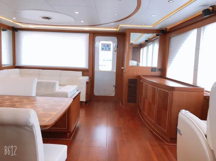  Yacht Photos Pics Luxurious interior of 2026 Selene 60 Explorer yacht with elegant wood finishes and white seating.