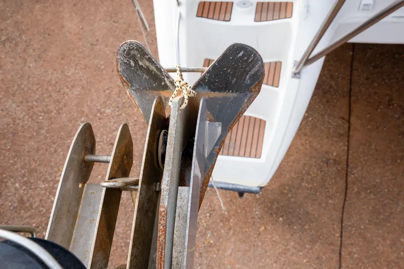  Yacht Photos Pics Anchor and deck of 2013 Jeanneau Sun Odyssey 439 sailboat, showing wear and rust.