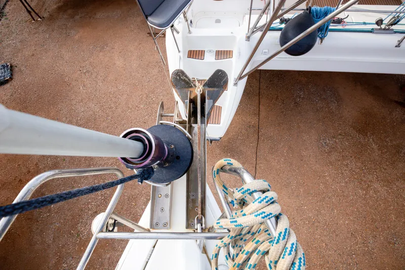  Yacht Photos Pics Top view of Jeanneau Sun Odyssey 439 sailboat deck, showcasing anchor and ropes.