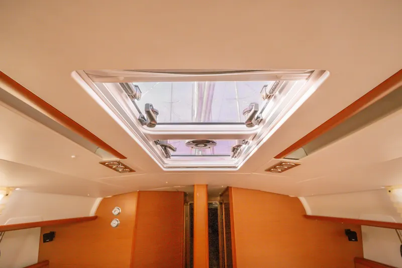 Yacht Photos Pics Interior view of 2013 Jeanneau Sun Odyssey 439 yacht with skylight.