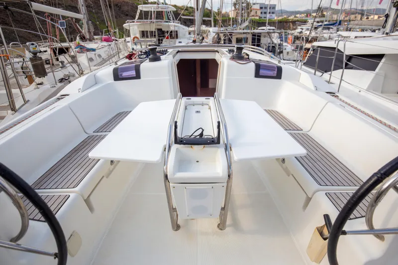  Yacht Photos Pics Cockpit of 2013 Jeanneau Sun Odyssey 439 sailboat with dual helm and foldable table.