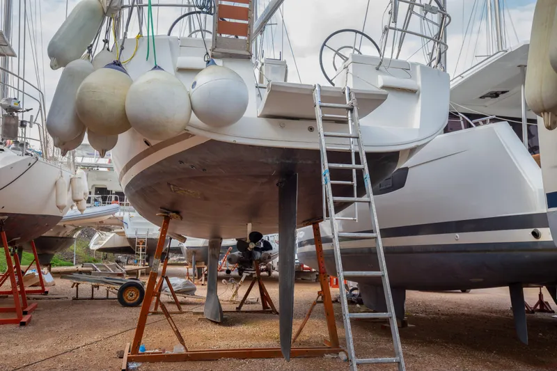  Yacht Photos Pics 2013 Jeanneau Sun Odyssey 439 sailboat on dry dock with ladder and fenders.