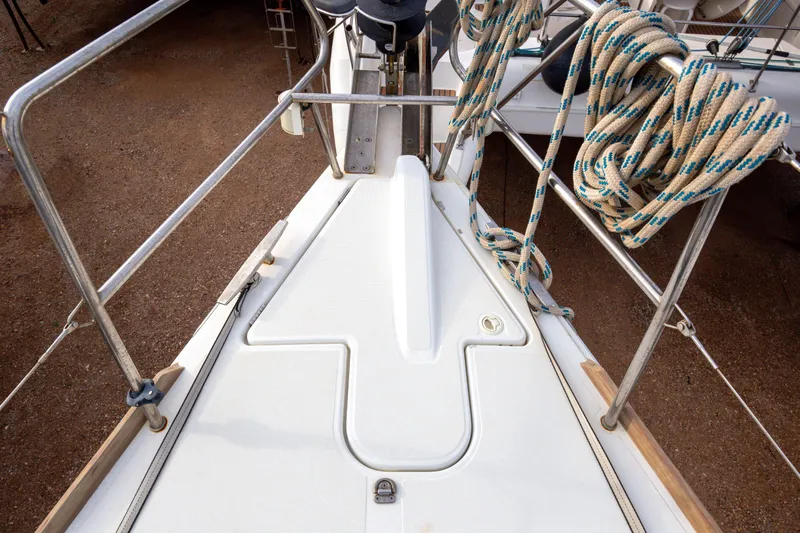  Yacht Photos Pics Deck of 2013 Jeanneau Sun Odyssey 439 sailboat with coiled ropes and metal railings.