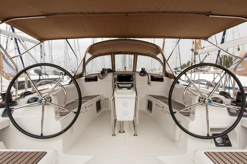  Yacht Photos Pics 2013 Jeanneau Sun Odyssey 439 yacht cockpit with dual steering wheels and navigation equipment.