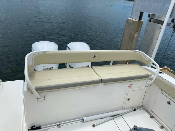 Gone Cucu Yacht Photos Pics Century 3200 Center Console 2020 boat with Yamaha 300 engines, docked by the water.