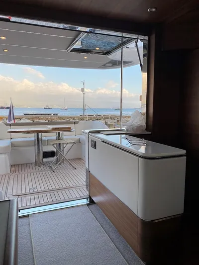 Panamera Yacht Photos Pics Interior view of 2020 Princess F62 yacht, featuring elegant deck and ocean backdrop.
