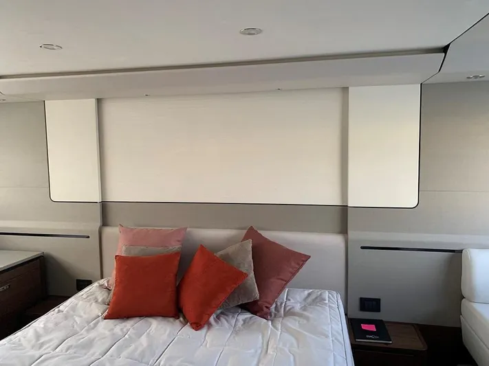 Panamera Yacht Photos Pics Luxurious bedroom interior of 2020 Princess F62 yacht with stylish pillows and modern design.