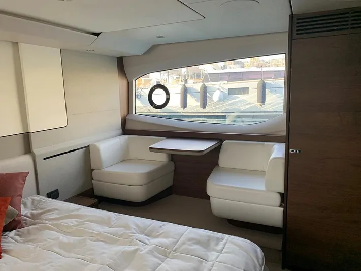 Panamera Yacht Photos Pics Luxurious interior of 2020 Princess F62 yacht with elegant seating and large window.