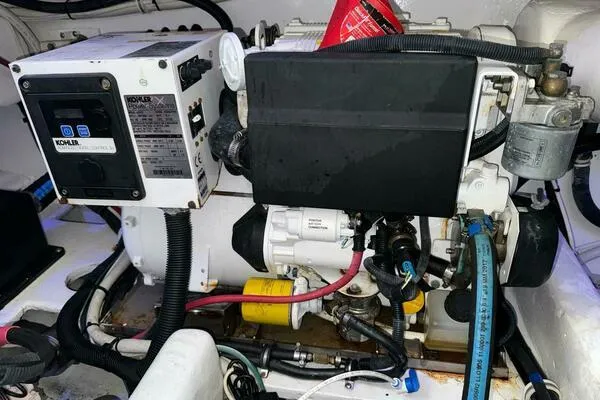 Joujou 2 Yacht Photos Pics Engine room of 2002 Luhrs 38 Open boat with Kohler generator.