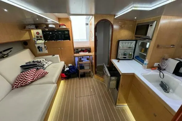 Joujou 2 Yacht Photos Pics Interior of 2002 Luhrs 38 Open yacht with kitchenette and seating area.