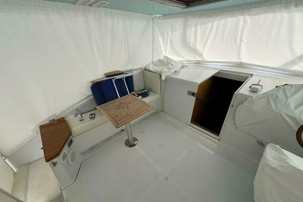 Joujou 2 Yacht Photos Pics 2002 Luhrs 38 Open boat interior with seating and table.