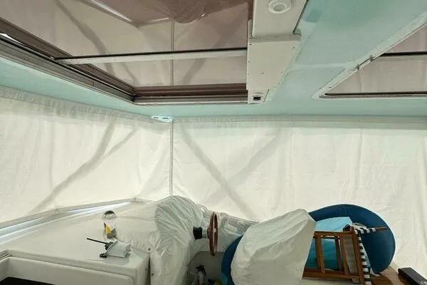 Joujou 2 Yacht Photos Pics Interior view of a 2002 Luhrs 38 Open boat with covered seating and helm.