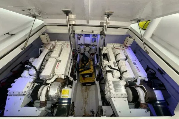 Joujou 2 Yacht Photos Pics Engine room of 2002 Luhrs 38 Open boat, featuring dual engines and mechanical components.