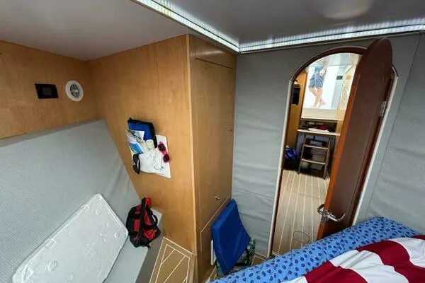 Joujou 2 Yacht Photos Pics Interior cabin of 2002 Luhrs 38 Open boat, featuring cozy seating and storage.