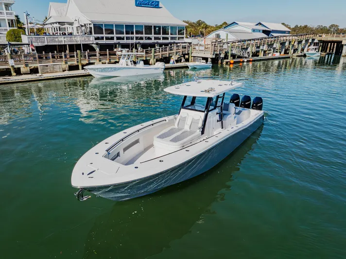  Yacht Photos Pics 2025 Invincible 36 Open Fisherman boat docked in a marina.