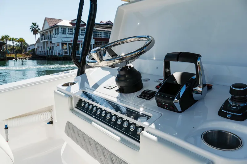  Yacht Photos Pics 2025 Invincible 36 Open Fisherman boat console with steering wheel and controls.