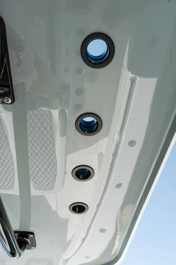  Yacht Photos Pics Close-up of 2025 Invincible 36 Open Fisherman boat hull with circular fittings.