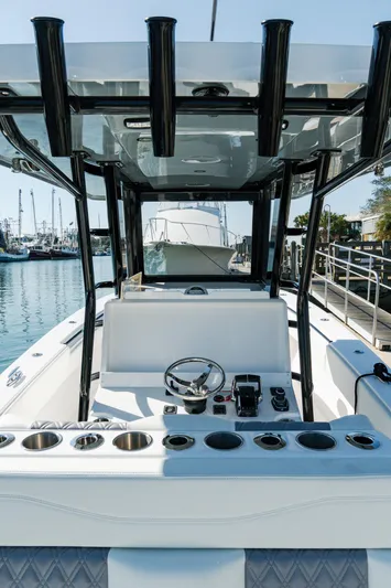  Yacht Photos Pics 2025 Invincible 36 Open Fisherman boat interior with steering wheel and controls.