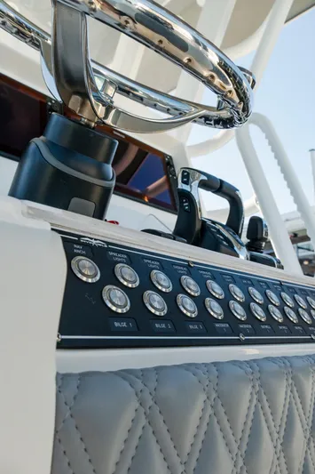  Yacht Photos Pics Control panel of 2025 Invincible 36 Open Fisherman boat with steering wheel.