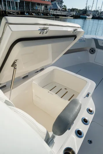  Yacht Photos Pics 2025 Invincible 36 Open Fisherman boat with open storage compartment, dockside view.