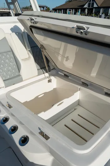  Yacht Photos Pics 2025 Invincible 36 Open Fisherman boat with open storage compartment.