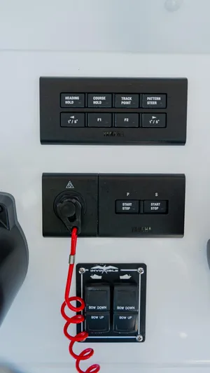  Yacht Photos Pics Control panel of 2025 Invincible 36 Open Fisherman boat with various switches and buttons.