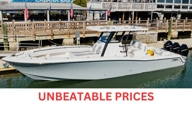  Yacht Photos Pics 2025 Invincible 36 Open Fisherman boat docked, showcasing sleek design and unbeatable prices.