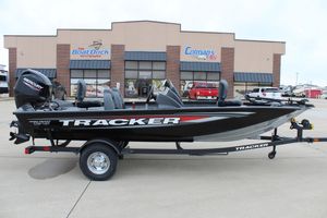 2025 Tracker Pro Team 175 Crappie Edition boat on trailer outside dealership.