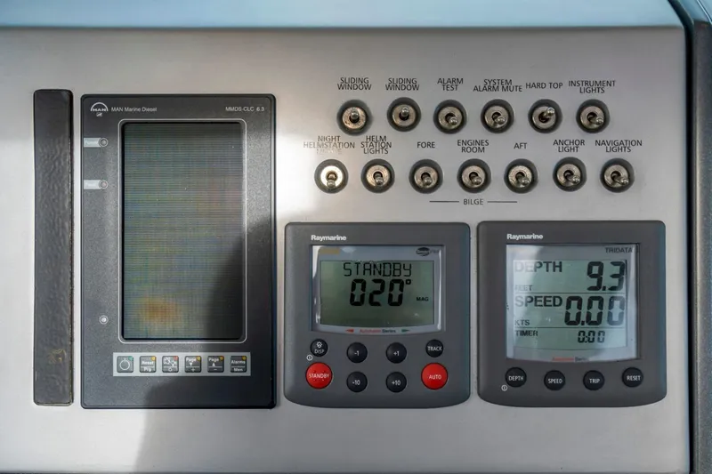  Yacht Photos Pics Control panel of a 2007 Azimut 68S yacht with navigation and engine displays.