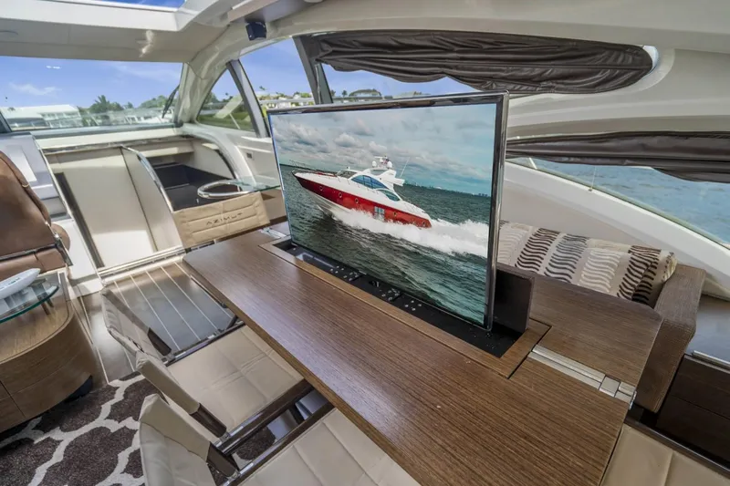  Yacht Photos Pics Luxurious interior of 2007 Azimut 68S yacht with modern TV and elegant furnishings.