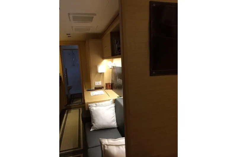 Whatif Yacht Photos Pics Interior of 2013 Lagoon 450 yacht, featuring cozy seating and a small desk area.