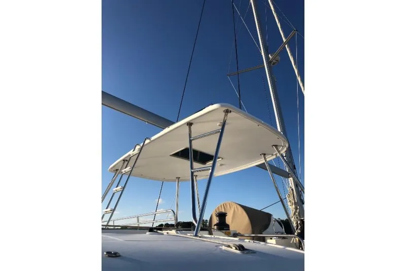 Whatif Yacht Photos Pics 2013 Lagoon 450 catamaran with sails against a clear blue sky.