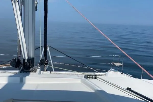 Whatif Yacht Photos Pics Sailing on a 2013 Lagoon 450 catamaran, calm ocean view.