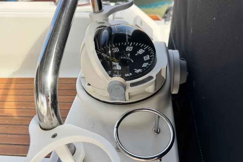 Shades Of Grey Yacht Photos Pics Compass on 2016 Beneteau Oceanis 48 yacht, featuring sleek design and wooden deck.