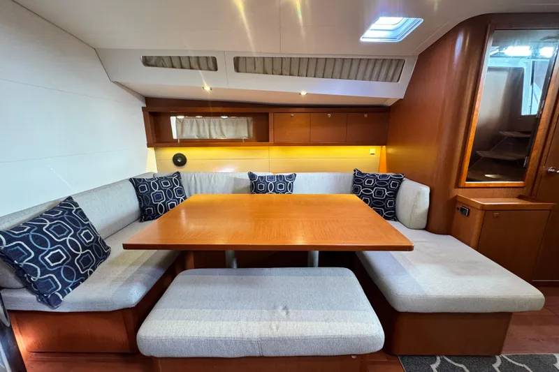 Shades Of Grey Yacht Photos Pics Interior of 2016 Beneteau Oceanis 48 yacht with cozy dining area and modern design.