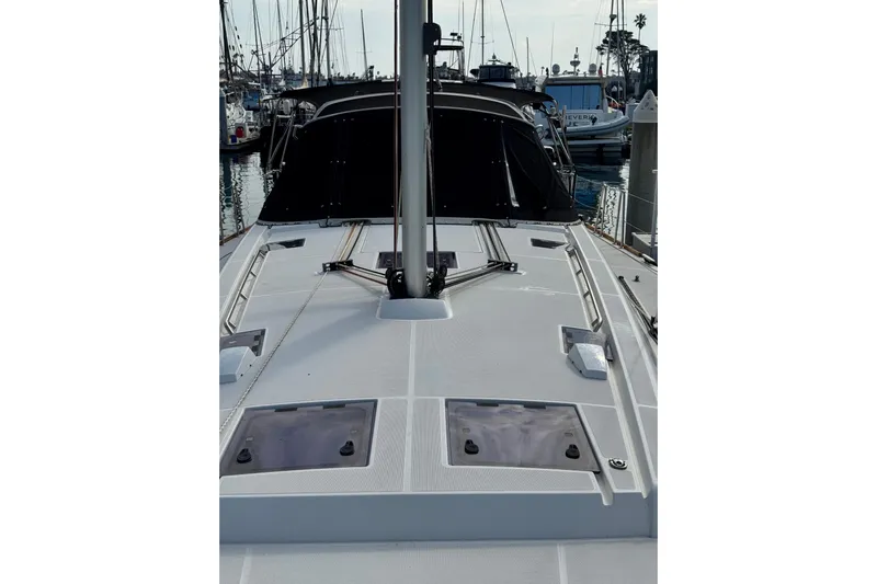 Shades Of Grey Yacht Photos Pics 2016 Beneteau Oceanis 48 sailboat deck view in marina setting.