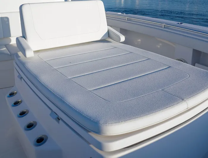 Another One Yacht Photos Pics Invincible 40 Catamaran 2019, white cushioned seating on deck, ocean background.