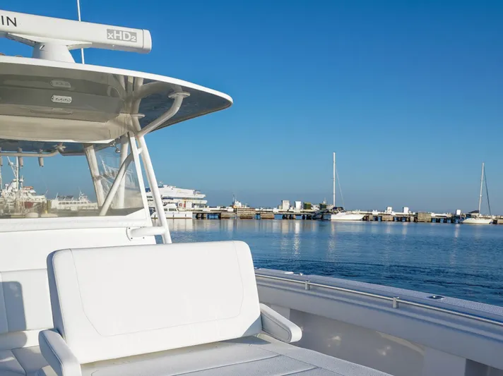 Another One Yacht Photos Pics Invincible 40 Catamaran 2019 docked at a marina under clear blue skies.