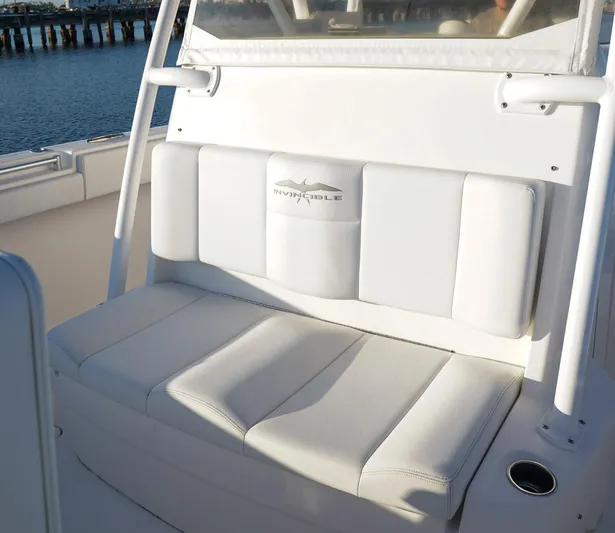 Another One Yacht Photos Pics White seating on 2019 Invincible 40 Catamaran, featuring sleek design and comfortable cushions.