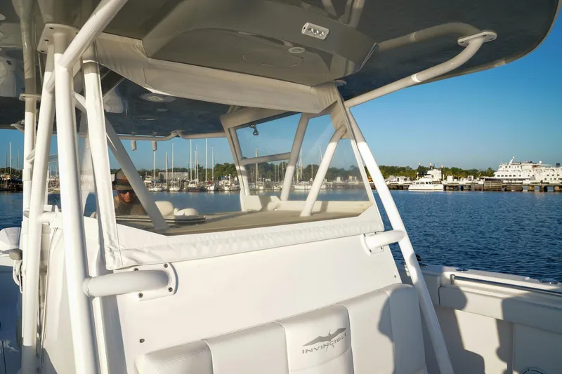 Another One Yacht Photos Pics 2019 Invincible 40 Catamaran on calm water, showcasing sleek design and marina backdrop.