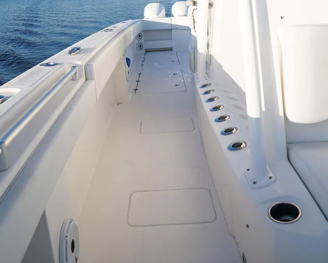 Another One Yacht Photos Pics 2019 Invincible 40 Catamaran deck with rod holders and clean white finish.