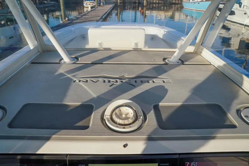 Another One Yacht Photos Pics 2019 Invincible 40 Catamaran deck with logo, docked at marina.