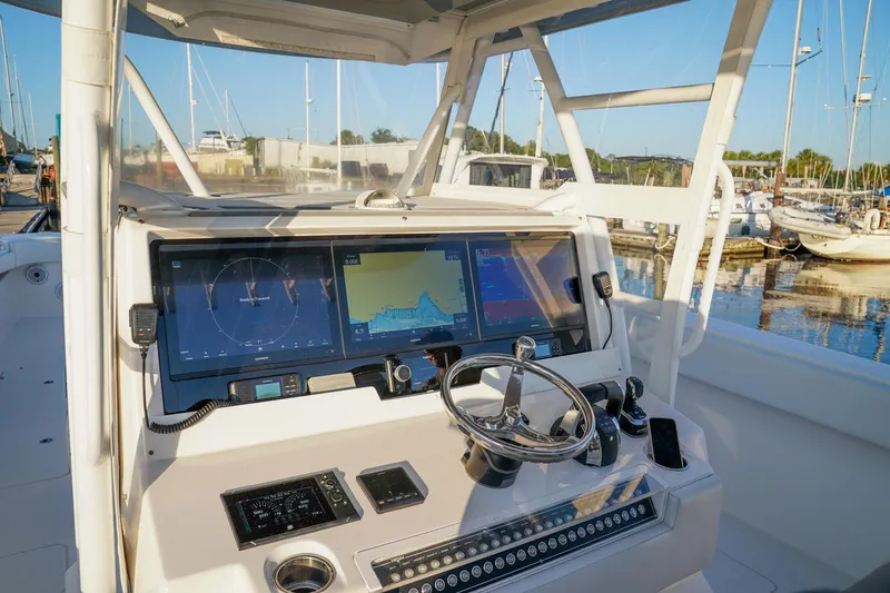 Another One Yacht Photos Pics 2019 Invincible 40 Catamaran helm with advanced navigation displays at marina.