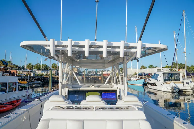Another One Yacht Photos Pics 2019 Invincible 40 Catamaran at marina, showcasing helm and seating area.