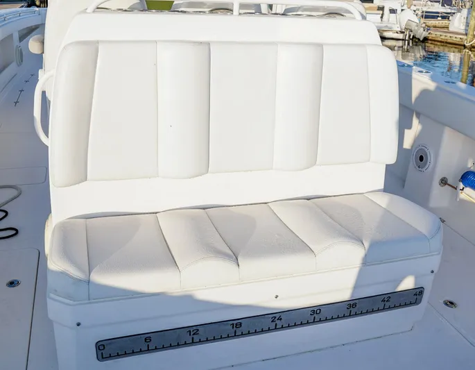 Another One Yacht Photos Pics White cushioned seating on 2019 Invincible 40 Catamaran with built-in measuring scale.