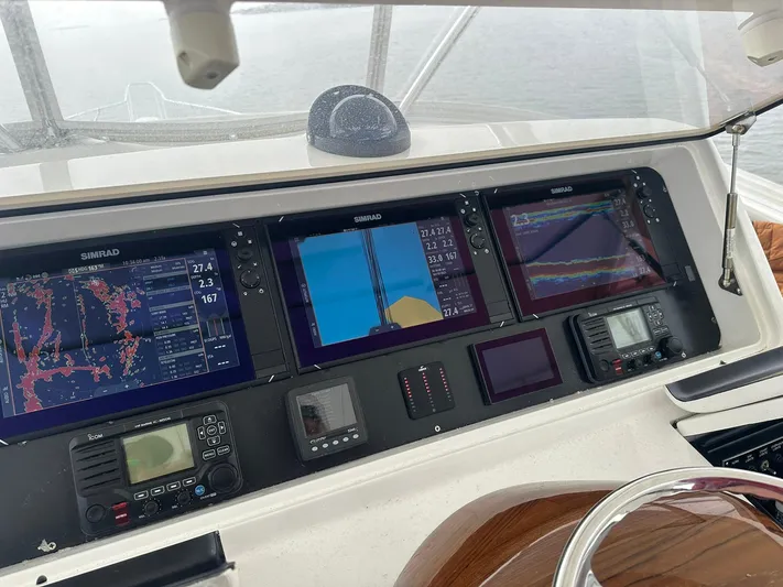  Yacht Photos Pics Control panel of a 2019 Viking 44 Convertible yacht with navigation screens.