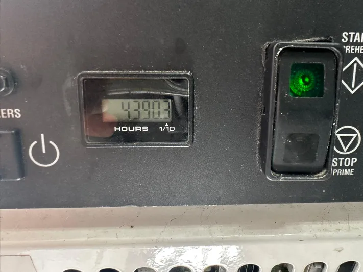  Yacht Photos Pics Hour meter and controls on 2019 Viking 44 Convertible boat dashboard.