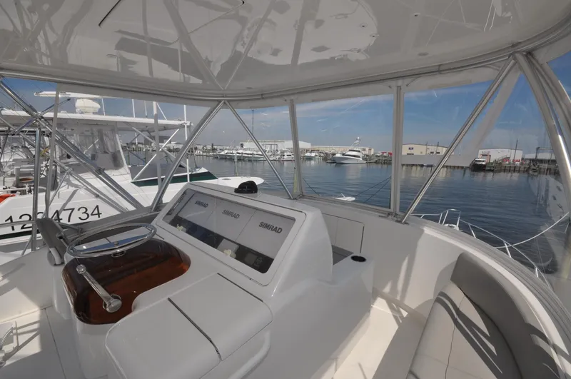  Yacht Photos Pics 2019 Viking 44 Convertible yacht helm with marina view.