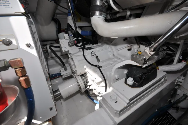  Yacht Photos Pics Engine room of 2019 Viking 44 Convertible yacht, showcasing mechanical components and piping.
