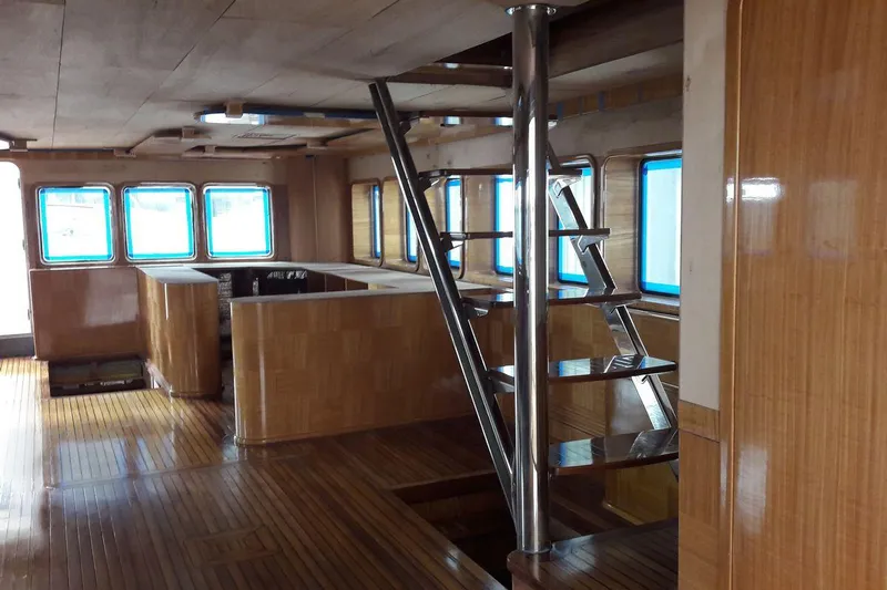 Svetlana (as Is) Yacht Photos Pics Luxurious interior of 2027 AvA Yachts Svetlana, featuring modern staircase and wooden finishes.